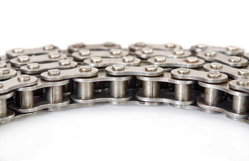 View of dirty roller chain on white background.